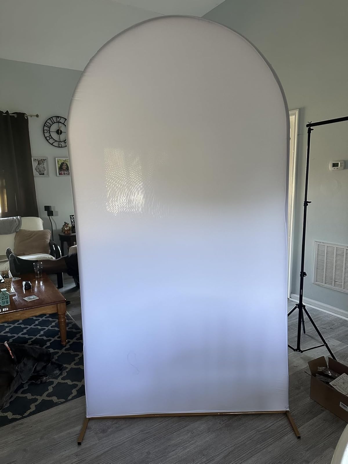 White arch stand with cover set up before adding balloons