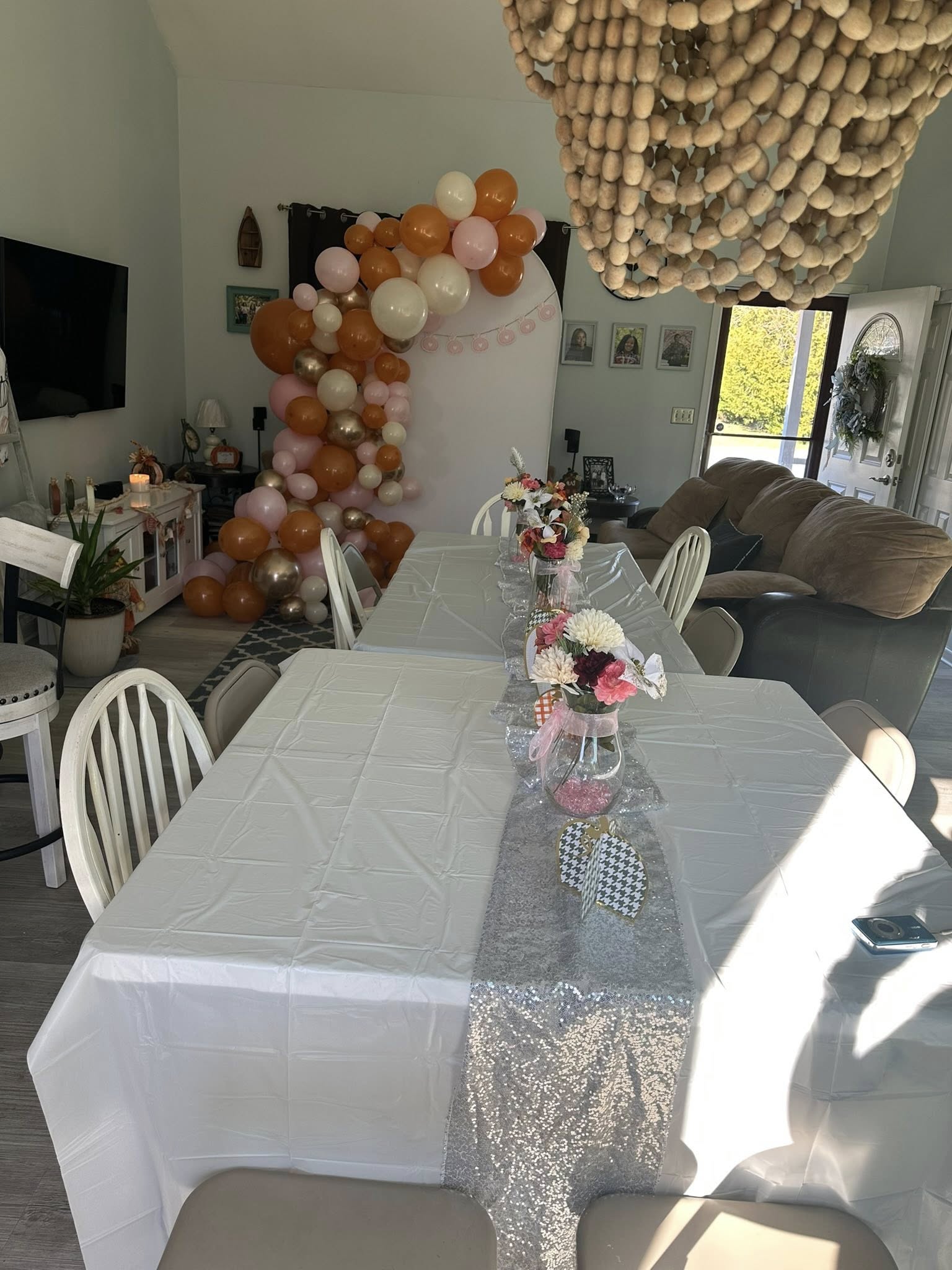 Friendsgiving table centerpiece with candles and fall accents