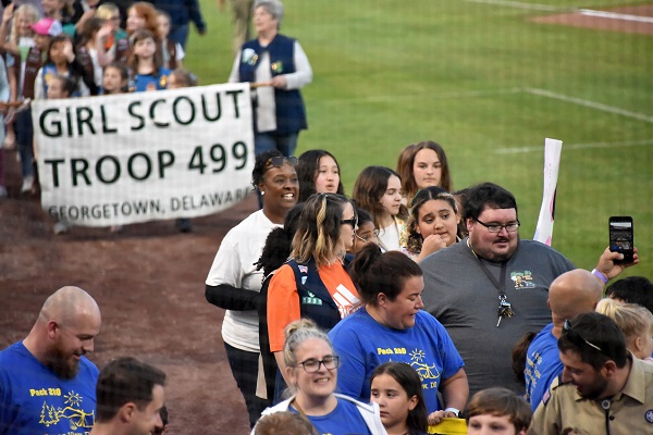 photo of troop in parade on the baseball field