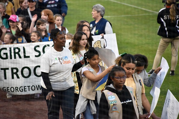 photo of troop in parade on the baseball field