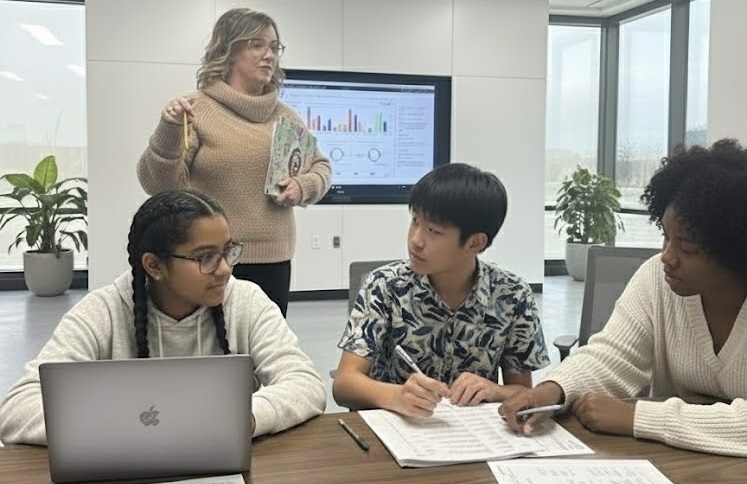 Teens in a workshop setting with a facilitator leading discussion